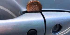 Here’s what it means if you spot a penny lodged in your car door handle