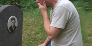 Man Stumbles upon a Headstone in the Woods and Sees His Childhood Photo on It
