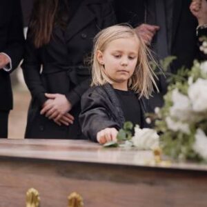 She Held Her Daughter at Her Husband’s Funeral — Then the Little Girl Whispered Something That Stopped the Church Cold